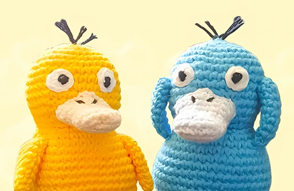 Duck-type amigurumi pattern with wings, tail, and beak