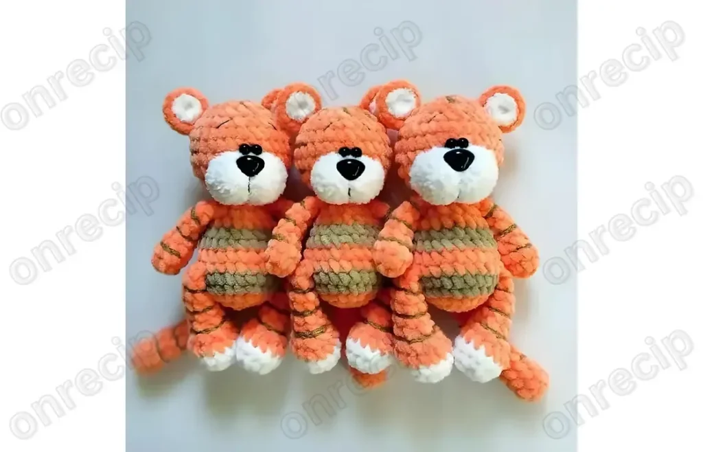 Amigurumi tiger cub pattern with plush body and tapered legs