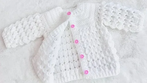Marshmallow stitch baby cardigan with a fan-stitch hem — photo 2